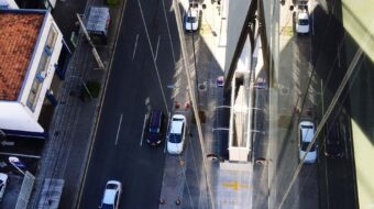 high-angle-view-vehicles-road-along-buildings